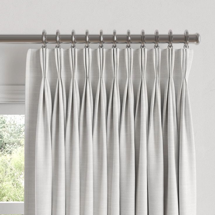 Office blinds curtains installer showcasing French pleat curtains in an executive office